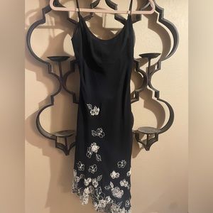 BCBG Maxazria black silk cocktail dress with white flower embroidery. Size 6